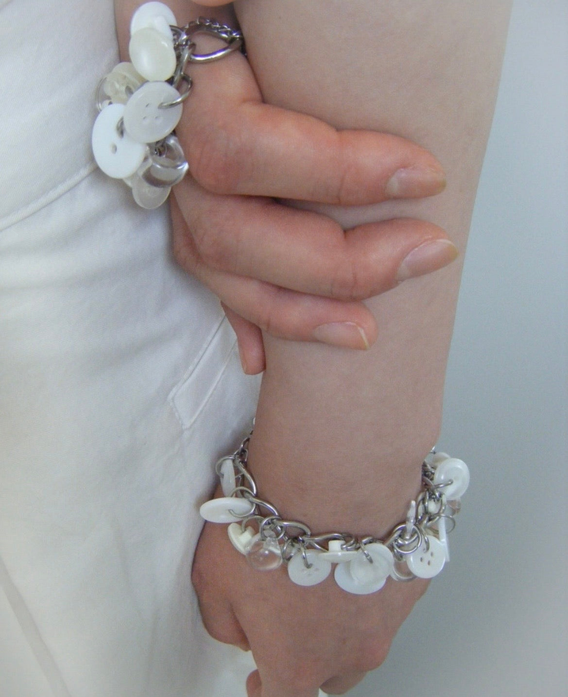 [sacred.] button bras. 1